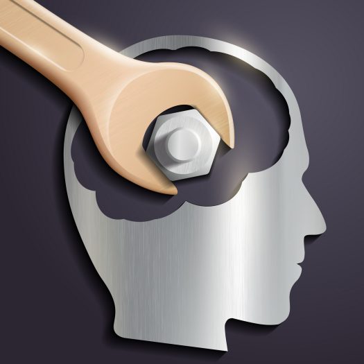 human head and a wrench with a nut